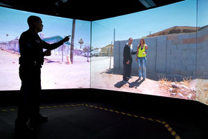 Omaha Police Officer Matt Austin tests his decision-making skills using the VirTra judgment simulator at the Omaha Public Safety Training Center. Officers have seconds to decide how to react to varying situations.