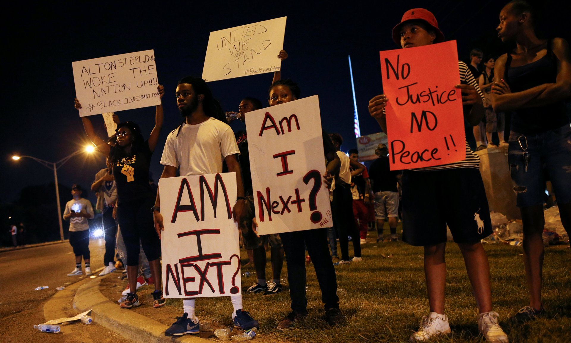 Demonstrators protest the shooting death of Alton Sterling near the headquarters of the Baton Rouge police department in Louisiana on Sunday. Photograph: Shannon Stapleton/Reuters
