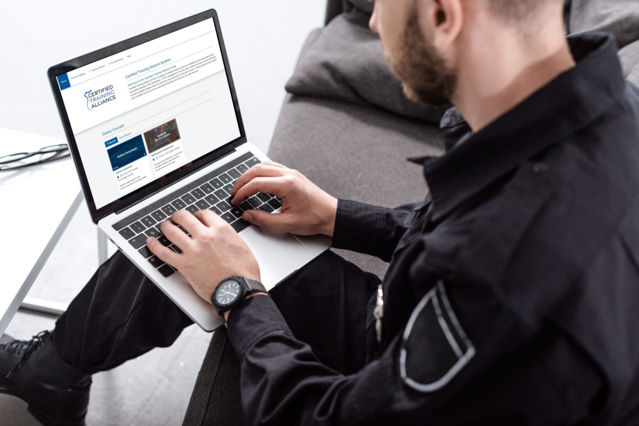 officer on laptop with cta page open