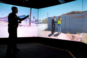  Omaha Police Officer Matt Austin tests his decision-making skills using the VirTra judgment simulator at the Omaha Public Safety Training Center. Officers have seconds to decide how to react to varying situations.